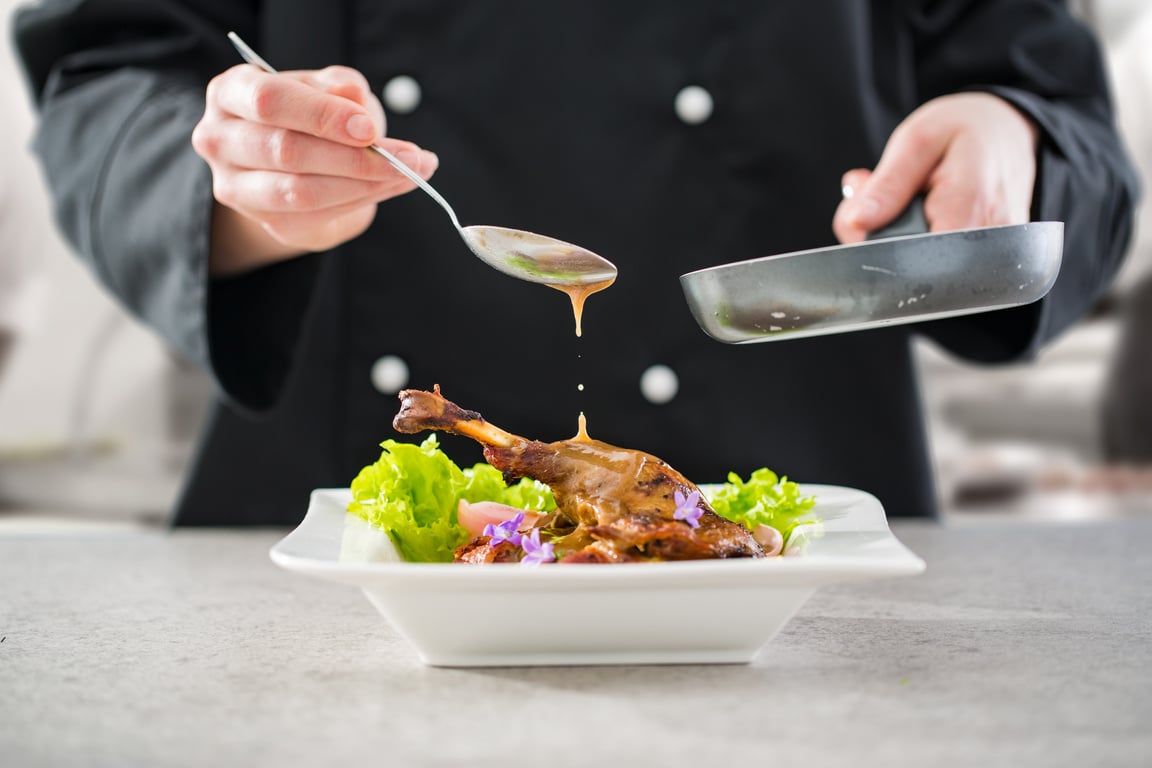 The chef prepares a gourmet meal.